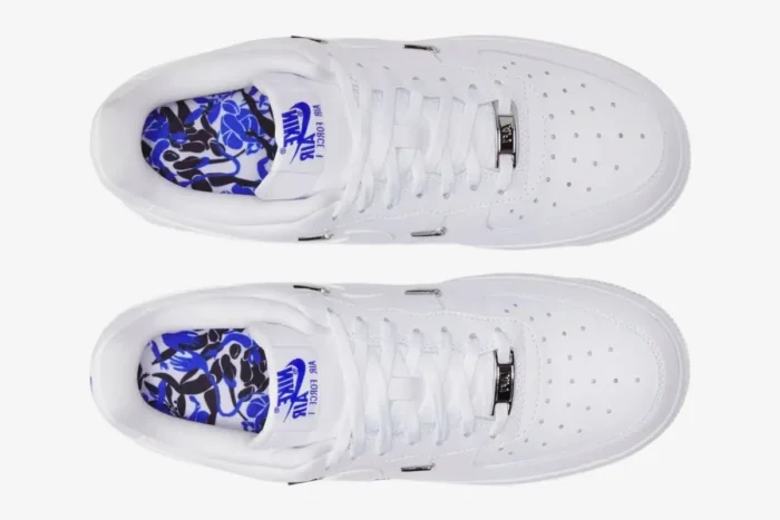 Top-down view of white Nike Air Force 1 '07 LX Chrome Deluxe Women's shoes with chrome accents and patterned insoles. - SKU CT1990-100