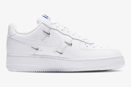 Nike Air Force 1 '07 LX Chrome Deluxe Women's shoe in white, side profile view with metallic accents. - SKU CT1990-100
