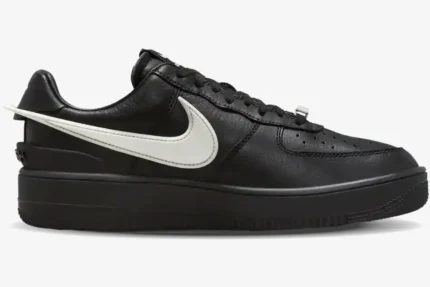 Nike Air Force 1 Low x Ambush in black leather with an oversized white Swoosh, side profile view. - SKU DV3464-001