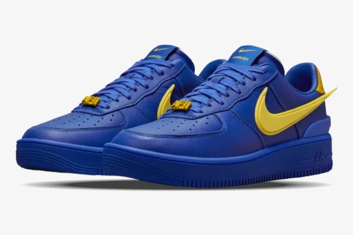 Nike Air Force 1 Low x Ambush sneakers in Game Royal blue and Vivid Sulphur yellow, three-quarter front view. - SKU DV3464-400