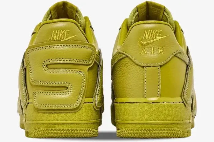 Rear view of mossy green Nike Air Force 1 Low x CPFM sneakers showing the unique oversized leather lettering. - SKU FQ7069-300
