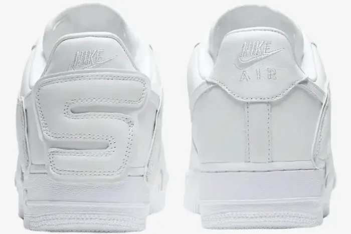 Rear view of white Nike Air Force 1 Low x Cactus Plant Flea Market sneakers with custom 'S' heel detail. - SKU FQ7069100
