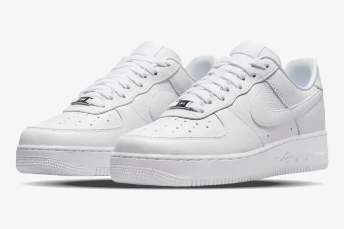 All-white Nike Air Force 1 Low x NOCTA Certified Lover Boy sneakers in a three-quarter front view. - SKU CZ8065-100