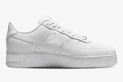 Side profile of a white Nike Air Force 1 Low x NOCTA Certified Lover Boy sneaker in tumbled leather. - SKU CZ8065-100