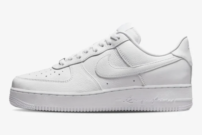 Side profile of the white Nike Air Force 1 Low x NOCTA Certified Lover Boy sneaker with script on the midsole. - SKU CZ8065-100