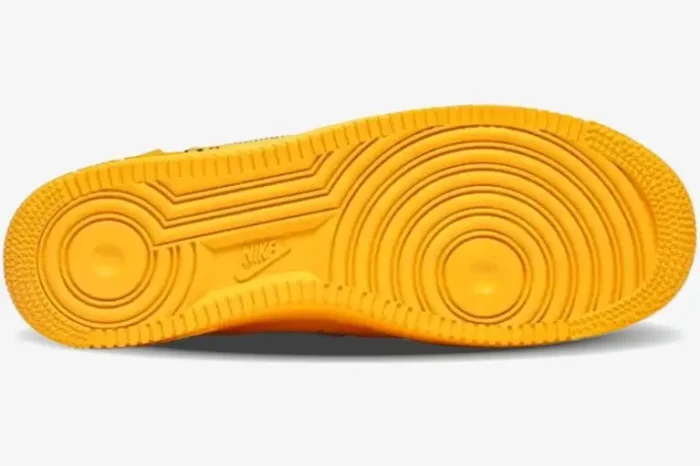 Bottom view of the University Gold Nike Air Force 1 Low x Off-White sole. - SKU DD1876-700