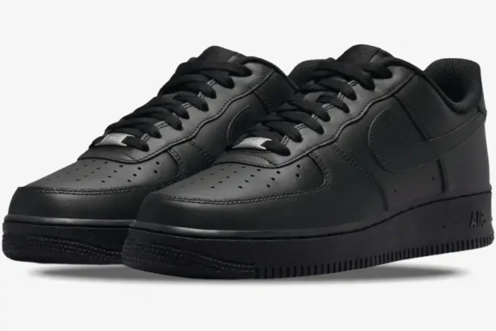 Three-quarter front view of Nike Air Force 1 Low x Supreme sneakers in triple black leather. - SKU CW2288-001