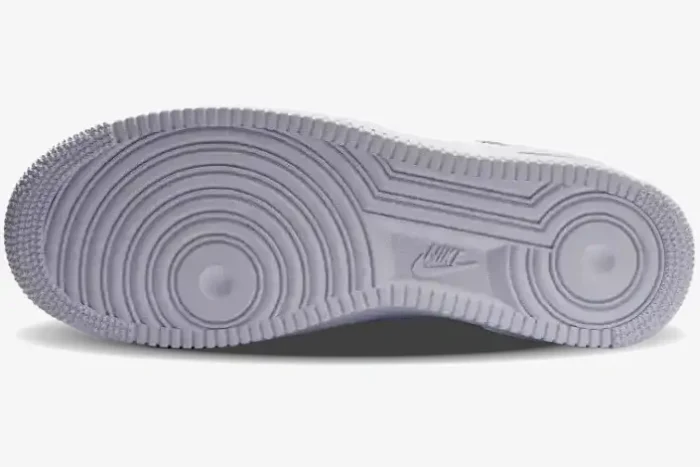 Bottom view of the white rubber outsole on a Nike Air Force 1 Low x Supreme sneaker. - SKU CU9225-100