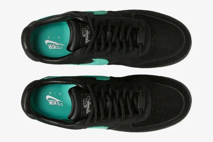 Top-down view of black suede Nike Air Force 1 Low x Tiffany & Co. sneakers featuring teal swooshes and insoles. - SKU DZ1382-001