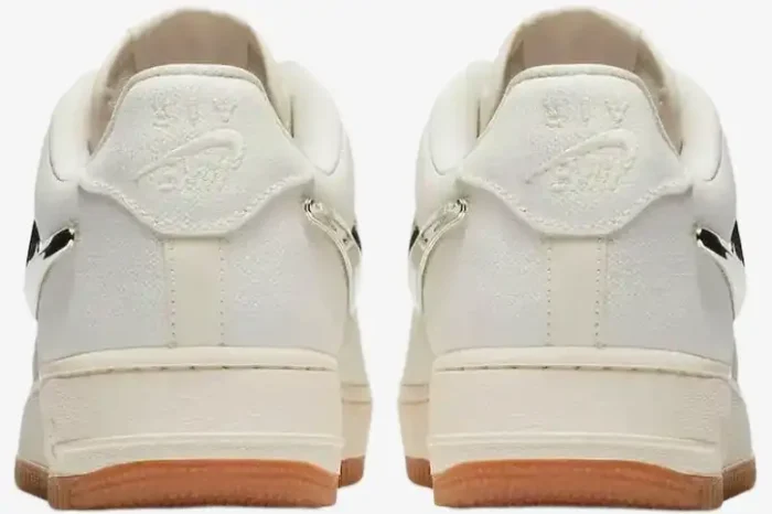 Rear view of Nike Air Force 1 Low x Travis Scott 'Sail' sneakers with canvas uppers and gum soles. - SKU AQ4211-101