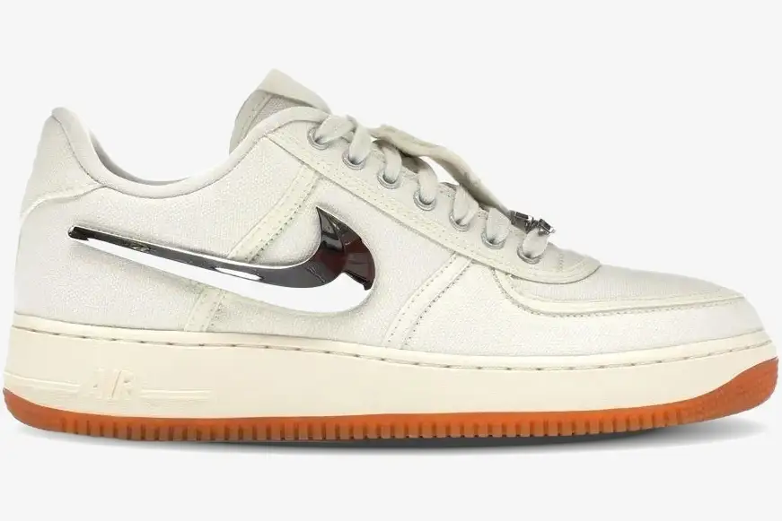 nike-air-force-1-low-travis-scott-sail-side-aq4211-101 Nike Air Force 1 Low x Travis Scott 'Sail' sneaker in a side profile view with a chrome swoosh and gum sole. - SKU AQ4211-101
