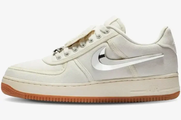 Side profile of Nike Air Force 1 Low x Travis Scott Sail sneakers with chrome swoosh and gum sole. - SKU AQ4211-101