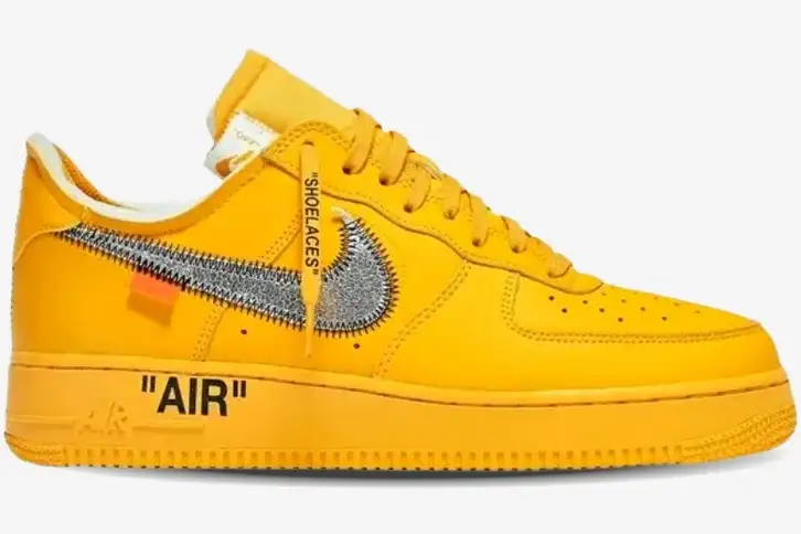 nike-air-force-1-off-white-university-gold-side-dd1876-700 Side profile of Nike Air Force 1 Low x Off-White University Gold sneakers with a metallic silver Swoosh. - SKU DD1876-700