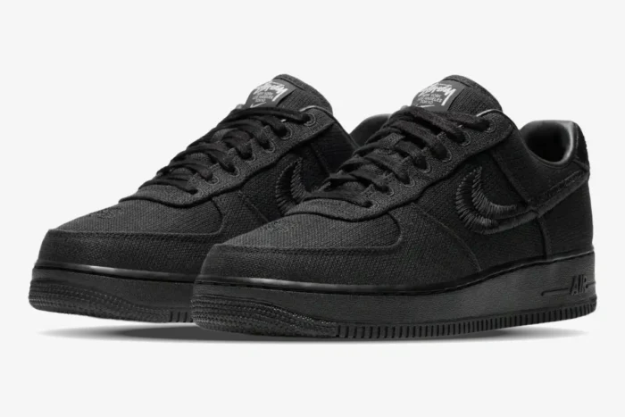 Nike Air Force 1 Low x Stussy Triple Black Hemp sneakers with textured uppers in a three-quarter front view. - SKU CZ9084-001