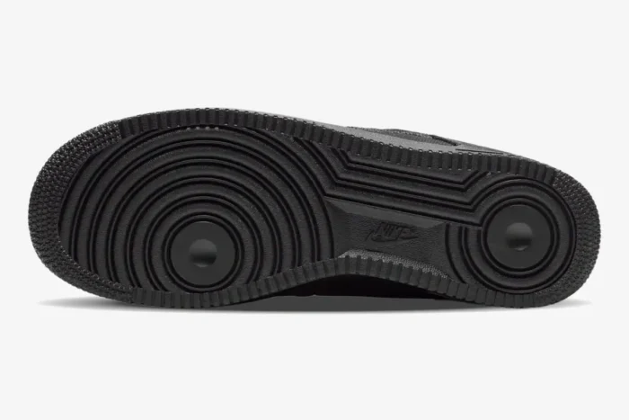 Bottom view of the Nike Air Force 1 Low x Stussy Triple Black Hemp showing the textured black rubber outsole. - SKU CZ9084-001