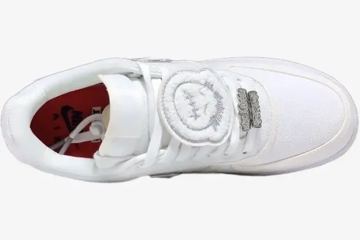 Top-down view of the Nike Air Force 1 Low x Travis Scott 'Sail' sneaker featuring canvas upper and patches. - SKU AQ4211-101