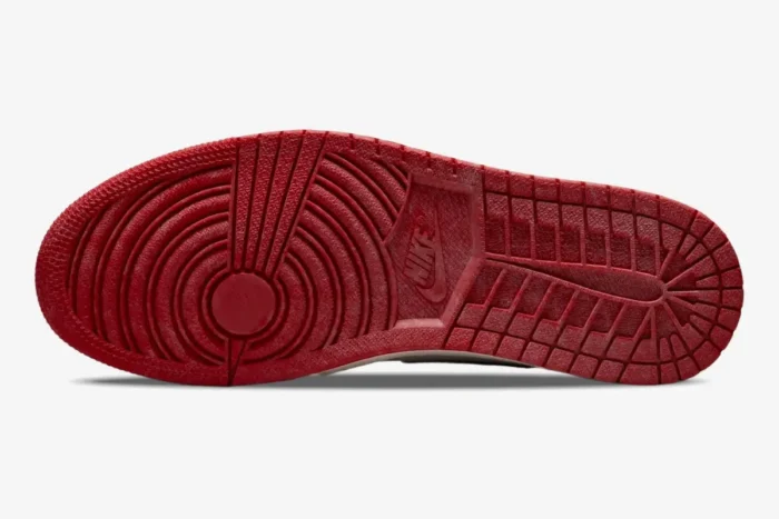 Bottom view of the Air Jordan 1 Retro High OG Chicago featuring a distressed red rubber outsole. - SKU 555088-101