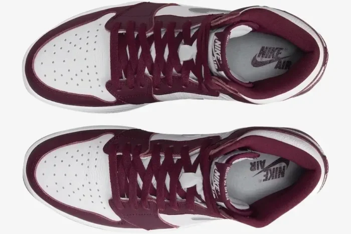 Top-down view of Air Jordan 1 High OG Bordeaux sneakers with white leather and maroon overlays. - SKU 555088-611