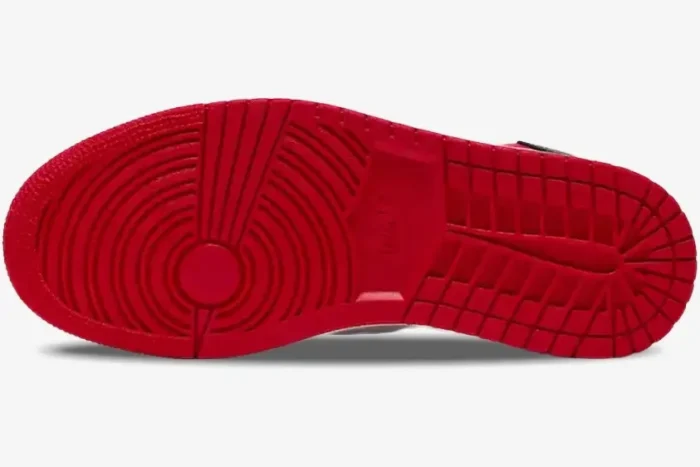 Red rubber outsole of Air Jordan 1 High OG 'Bred Toe' sneakers, bottom view showing traction pattern. - SKU 555088-610