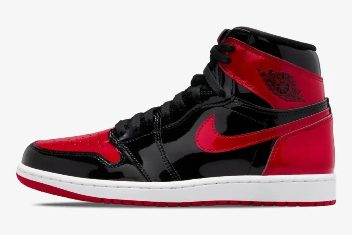 Side profile of Air Jordan 1 High OG Patent Bred sneakers in glossy black and red. - SKU 555088-063