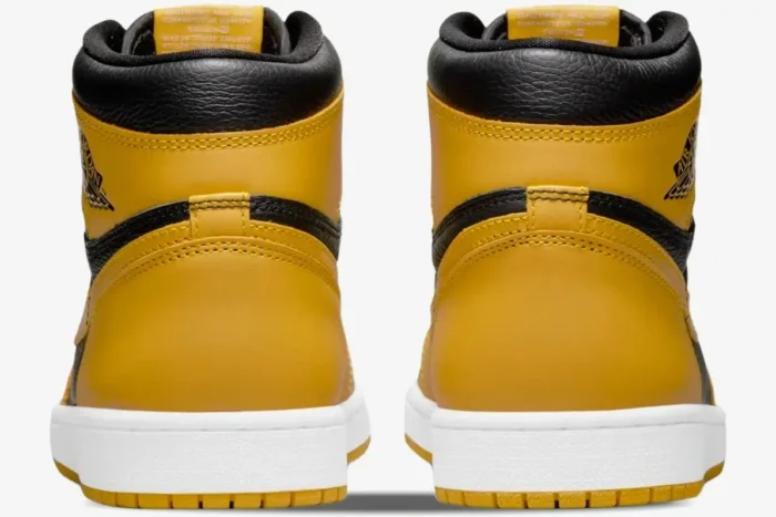 Rear view of Air Jordan 1 High OG Pollen sneakers in yellow and black with white midsoles.
