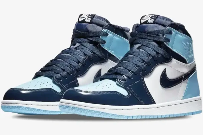 Air Jordan 1 High UNC Patent Women's sneakers in obsidian and blue chill, three-quarter front view. - SKU CD0461-401