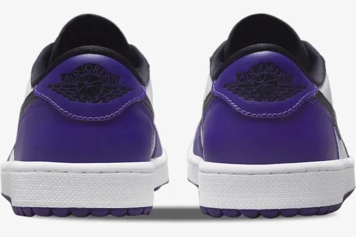 Rear view of Air Jordan 1 Low Golf 'Court Purple' sneakers featuring purple heels and black wings logos. - SKU DD9315-105