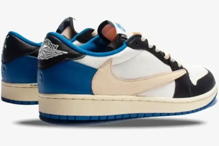 Nike Air Jordan 1 Low x Travis Scott x Fragment in blue and white, rear three-quarter view showing reverse swoosh. - SKU DM7866-140
