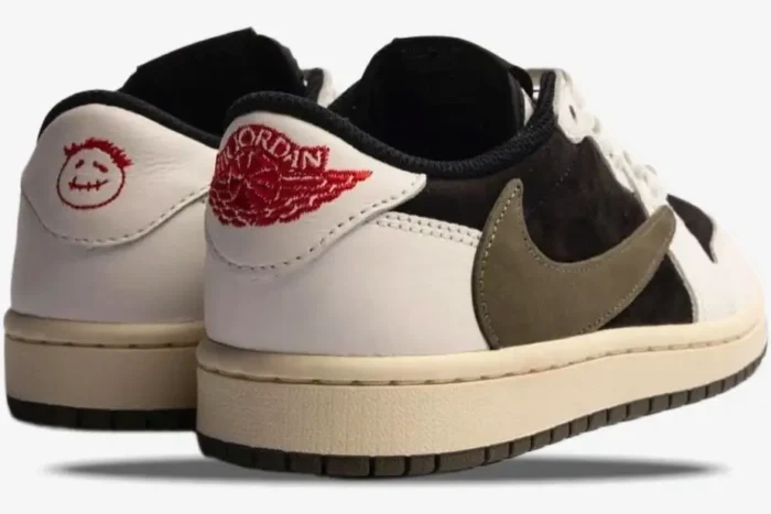Rear view of Air Jordan 1 Low x Travis Scott Olive sneakers featuring red embroidered logos on white leather heels. - SKU DZ4137-106