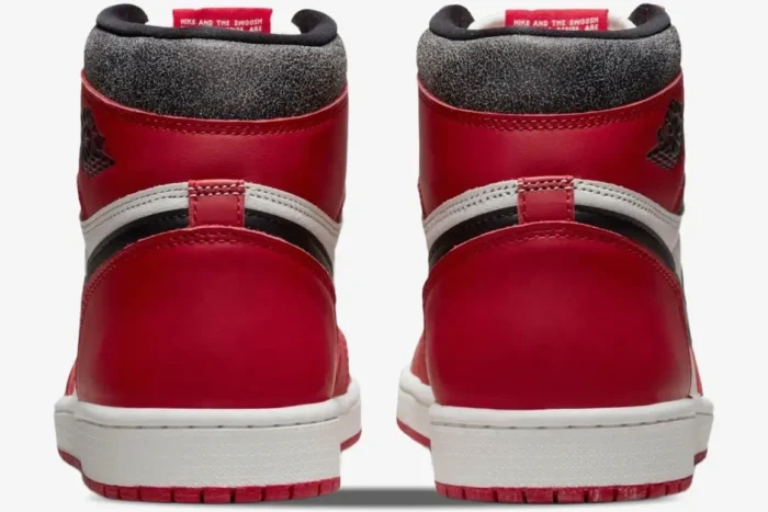 Rear view of Air Jordan 1 Retro High OG Chicago sneakers featuring red leather and cracked black collars. - SKU 555088-101