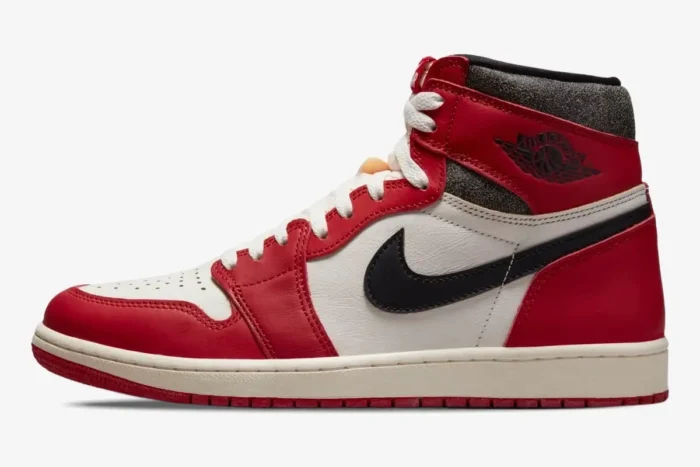Side profile of Air Jordan 1 Retro High OG Chicago sneakers in red, white, and black. - SKU 555088-101