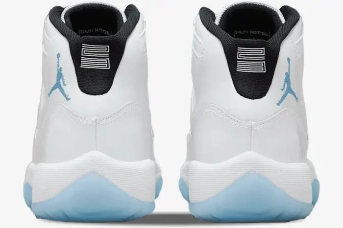 Rear view of Air Jordan 11 Retro Legend Blue sneakers featuring white leather and blue Jumpman logos. - SKU 378037-117