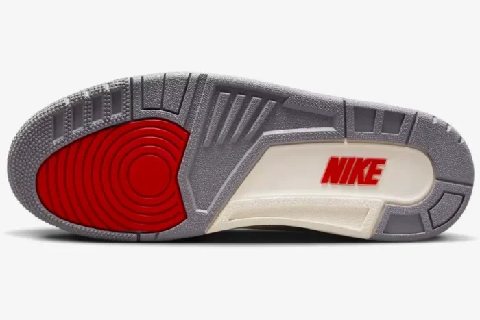 Outsole of Air Jordan 3 Retro White Cement Reimagined featuring red pivot point and Nike branding. - SKU DN3707-100