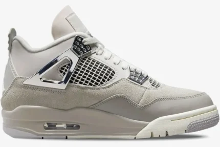 Side profile of the Air Jordan 4 Retro Frozen Moments in light grey and beige with metallic silver accents. - SKU AQ9129-001