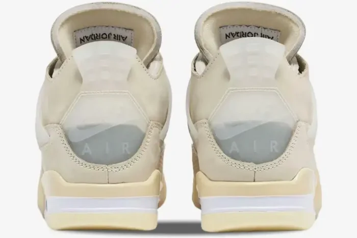 Rear view of Air Jordan 4 Retro x Off-White Sail sneakers featuring translucent Nike Air heel tabs. - SKU CV9388-100