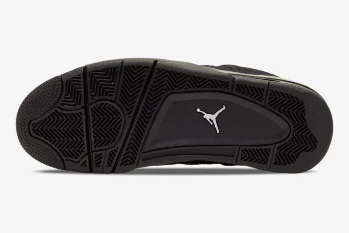 Outsole view of the Air Jordan 4 Retro Black Cat shoe in all black with a white Jumpman logo. - SKU CU1110-010