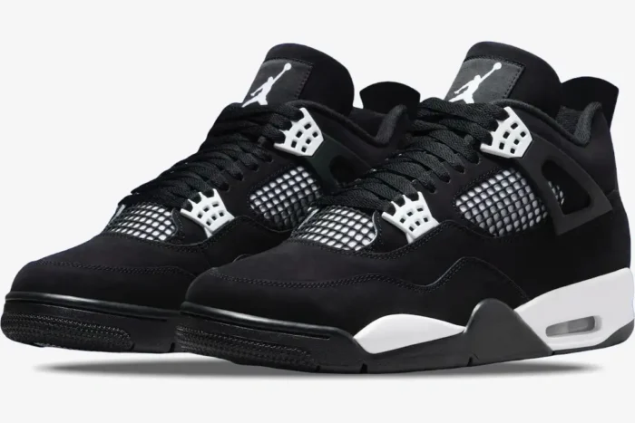 Black and white Air Jordan 4 Retro sneakers in a three-quarter side view with suede uppers. - SKU FQ8138-001