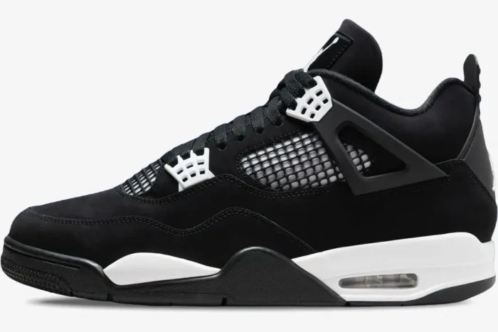 Side profile of Air Jordan 4 Retro sneakers in black and white with visible Air unit. - SKU FQ8138-001