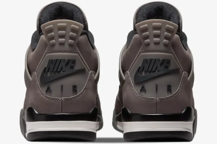 Rear view of the Air Jordan 4 Retro Cave Stone and Black sneakers showing the Nike Air heel branding. - SKU  FV5029-200