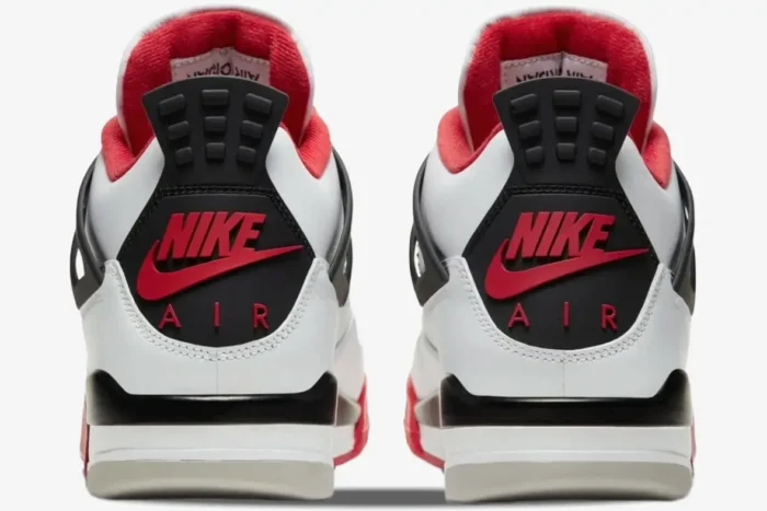 Rear view of Air Jordan 4 Retro Fire Red sneakers featuring the red Nike Air logo on the black heel tab. - SKU DC7770-160