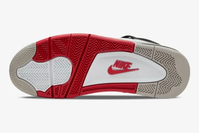 Sole of Air Jordan 4 Retro Fire Red sneaker showing red, white, and grey traction pattern and Nike logo. - SKU DC7770-160