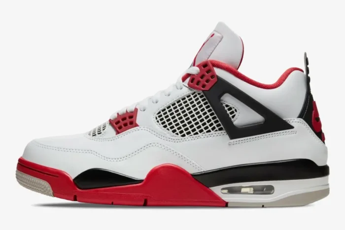 Side profile of Air Jordan 4 Retro Fire Red sneakers in white, black, and red leather. - SKU DC7770-160