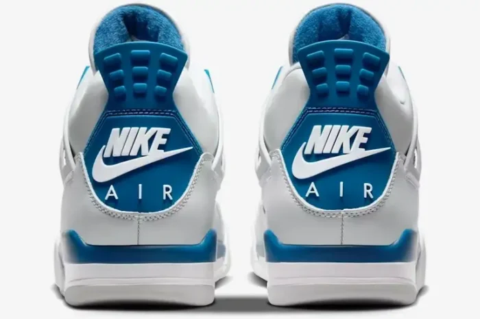 Rear view of Air Jordan 4 Retro sneakers in white and industrial blue with Nike Air heel logo. - SKU FV5029-141