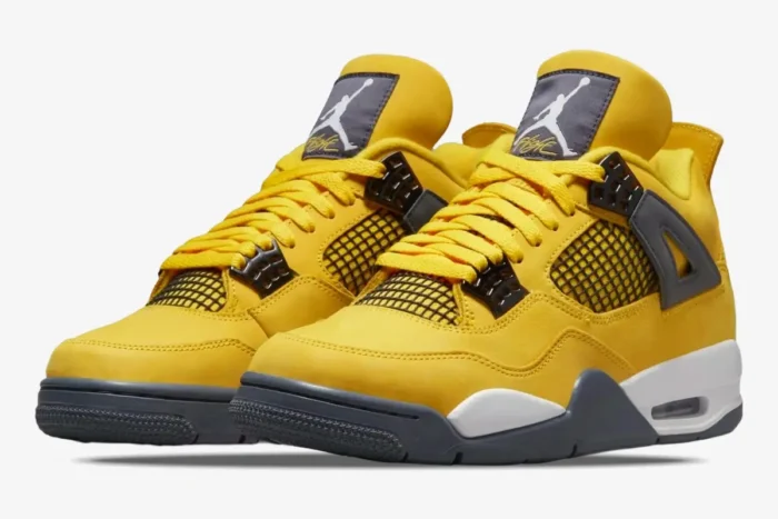 Yellow Air Jordan 4 Retro Lightning sneakers with black accents, three-quarter front view on white background. - SKU CT8527-700