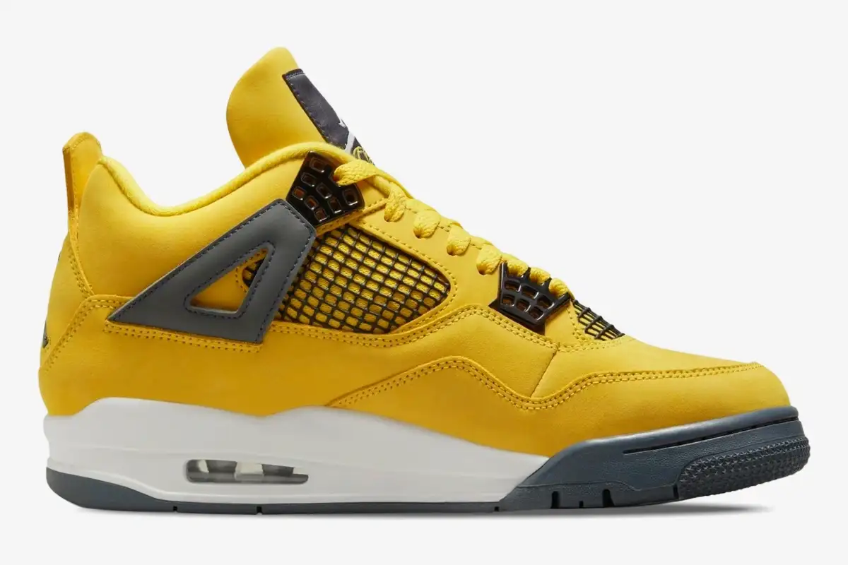 nike-air-jordan-4-retro-lightning-side-view-ct8527-700-568-125 Side profile of yellow Air Jordan 4 Retro Lightning sneakers with grey accents and white midsole. - SKU CT8527-700
