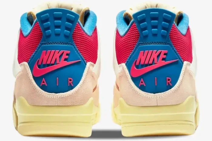 Rear view of Air Jordan 4 x Union LA Guava Ice sneakers showing pink Nike Air heel tabs and blue accents. - SKU DC9533-800
