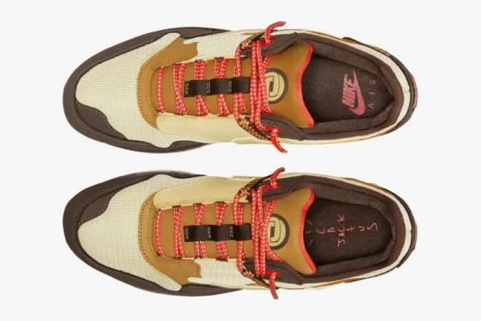 Top-down view of Nike Air Max 1 x Cactus Jack Baroque Brown sneakers with red laces and cream mesh. - SKU DO9392-200