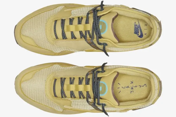 Top-down view of Nike Air Max 1 x Travis Scott Cactus Saturn Gold sneakers with patterned laces. - SKU DO9392-700