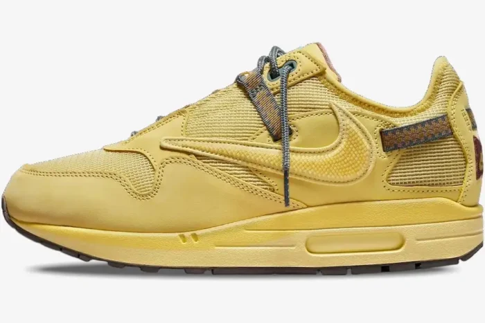 Side profile of the Nike Air Max 1 x Travis Scott Cactus Saturn Gold sneaker in monochromatic yellow. - SKU DO9392-700
