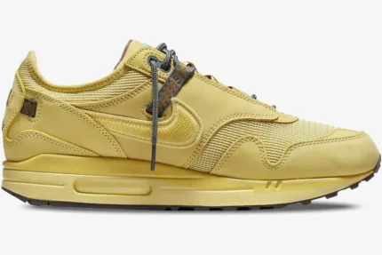 Side profile view of the Nike Air Max 1 x Travis Scott Cactus Saturn Gold sneaker. - SKU DO9392-700